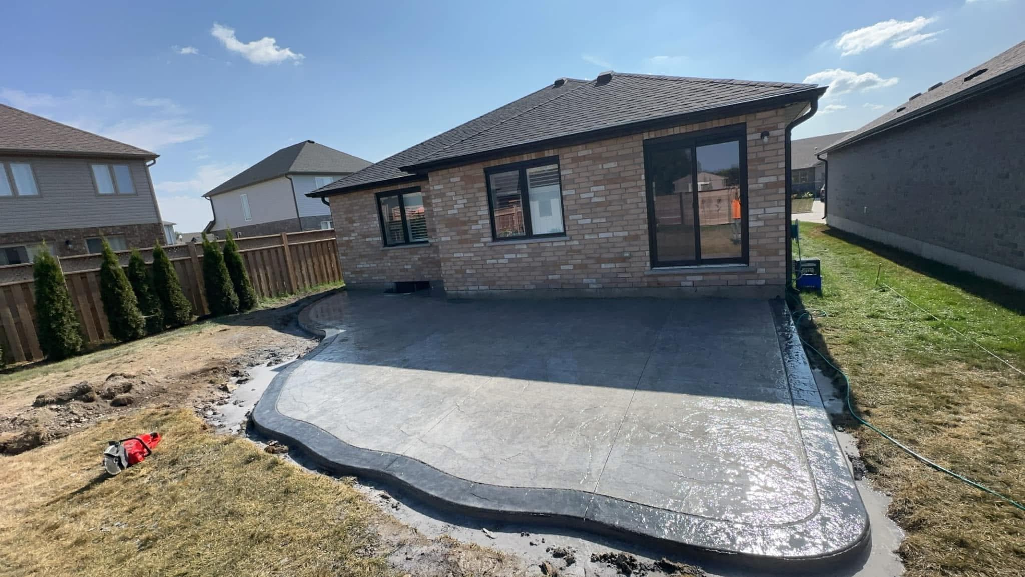 Curved stamped patio · K-W — decorative concrete work by IronGround in Kitchener-Waterloo